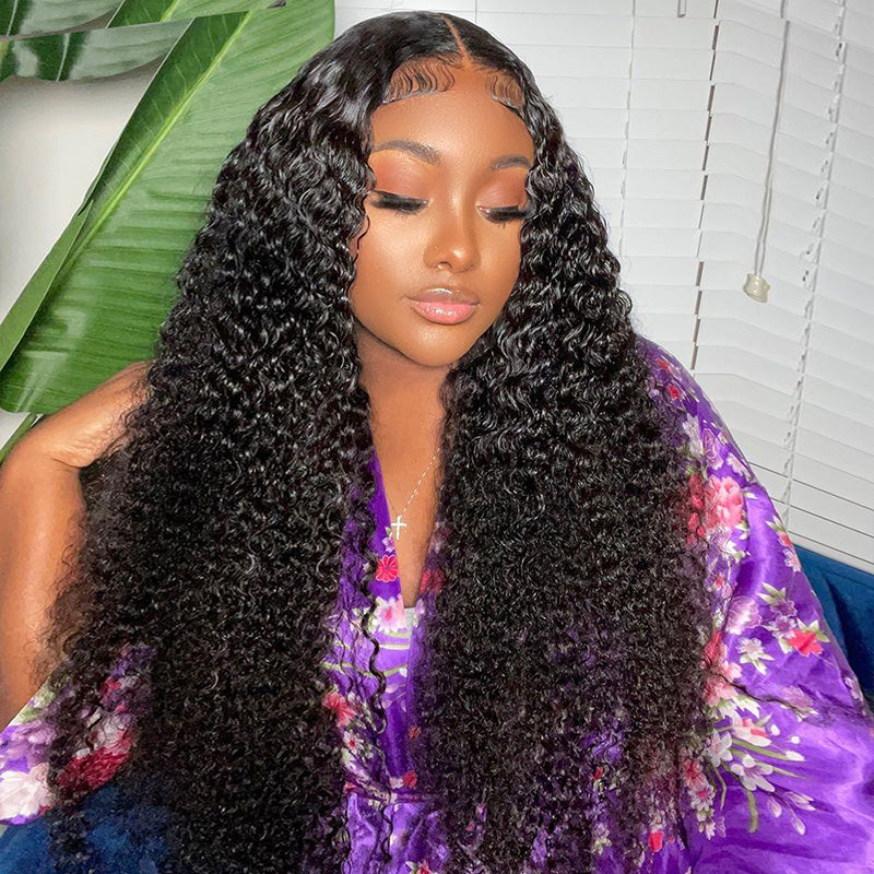 Woman wearing a long water wave human hair wig with a pre-plucked styled hairline and HD lace frontal, dressed in a brown button-up top.