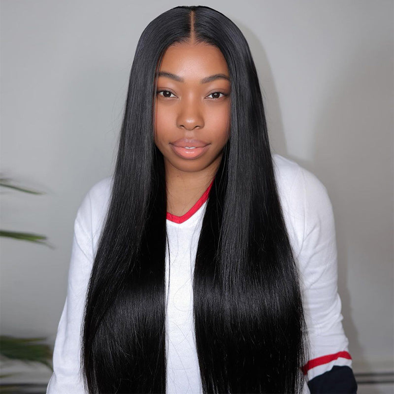 Woman modeling a long, straight, natural black high-density wig with a pre-plucked hairline, wearing a beige, zip-up top, available at Ishow Beauty.
