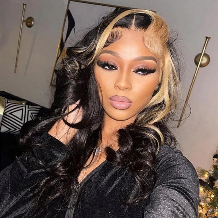 Model wearing Ishow 1B/27 Highlight HD Lace Body Wave Wig, featuring long wavy black and blonde hair, white sleeveless top, silver chain necklace, and cross earrings.