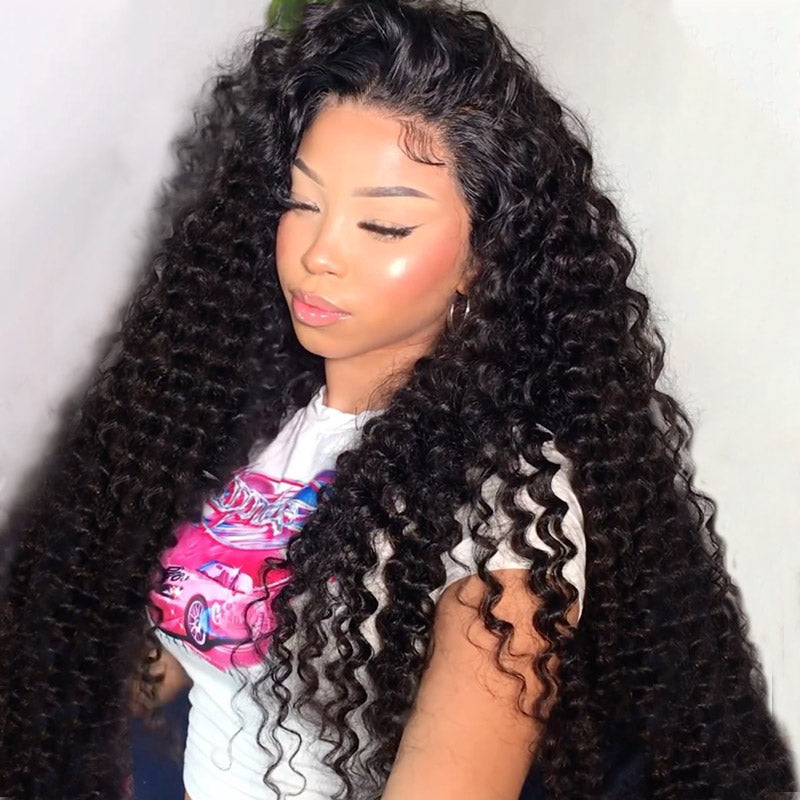 Woman with burmese burly hair bundles with deep part closure wearing a white shirt