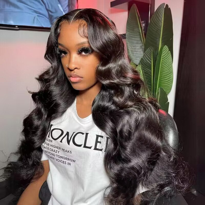 Model With Malaysian Body Wave Hair Extensions in Loose Waves, Wearing a White Shirt