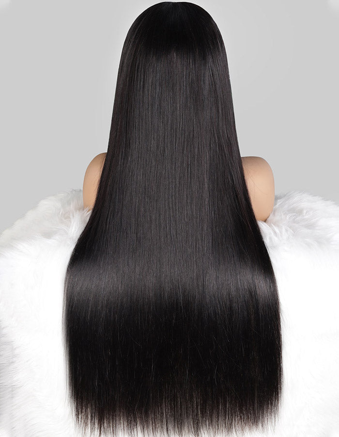 Long, Sleek, Straight Black Wig Displayed From the Back On a White Fur Backdrop