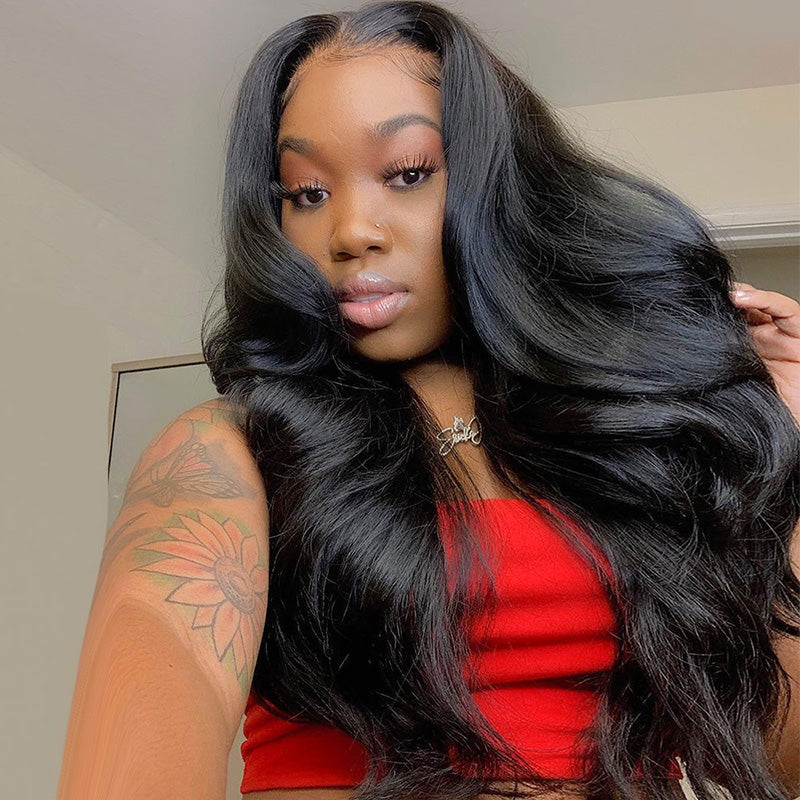 Woman With Long Body Wave Black Hair Wearing a Red Top