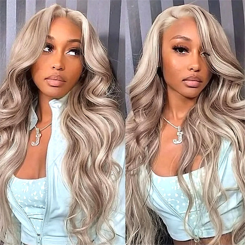 Model With Long Blonde Highlight Body Wave Hairstyle Wearing a Mint Green Outfit