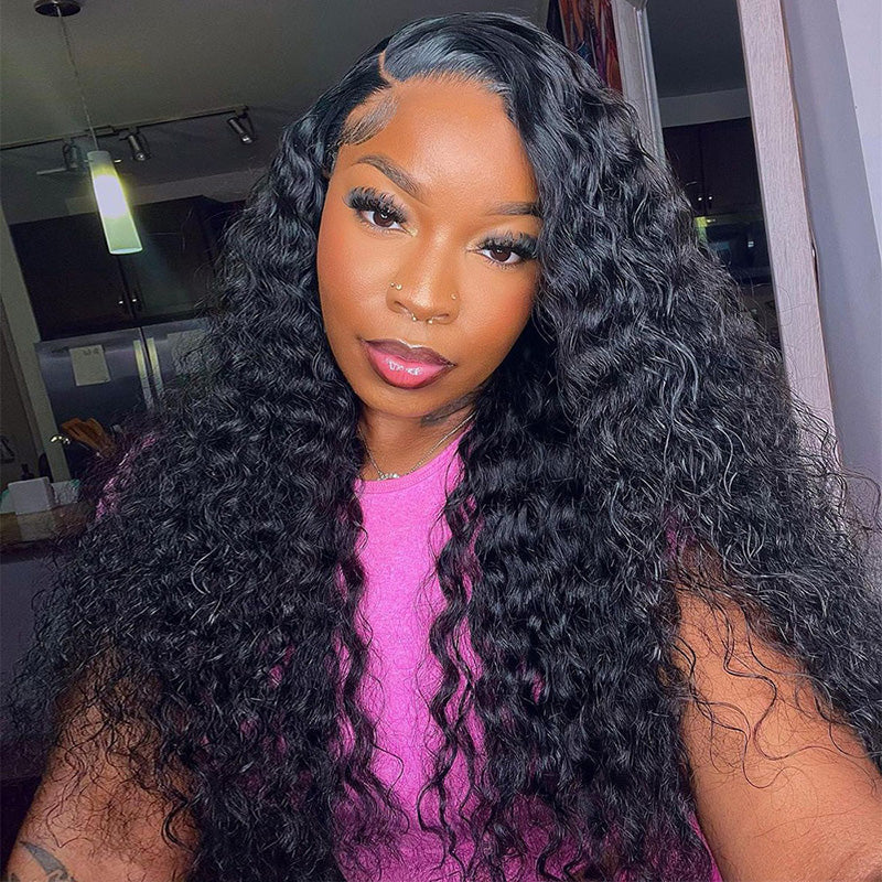 Woman Showcasing Natural Black Deep Wave Wig, Smiling, in a Pink Top