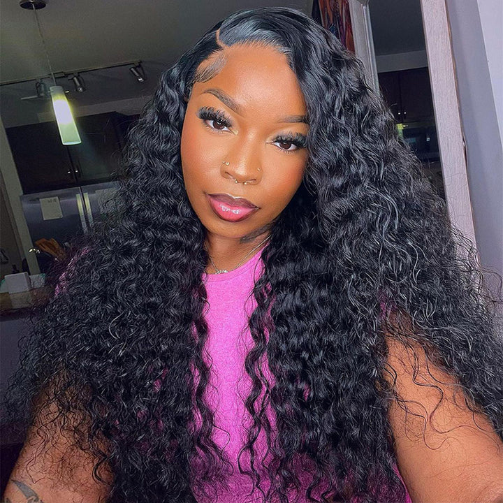 Woman Showcasing Natural Black Deep Wave Wig, Smiling, in a Pink Top