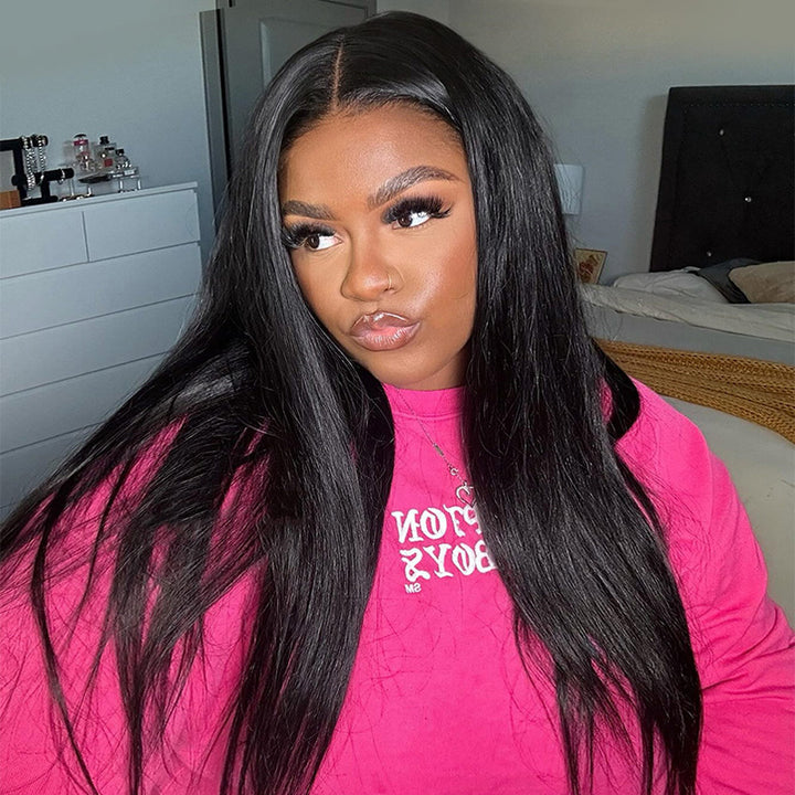 Woman With Sleek, Long Straight Black Hair Wig in a Stylish Pink Sweatshirt