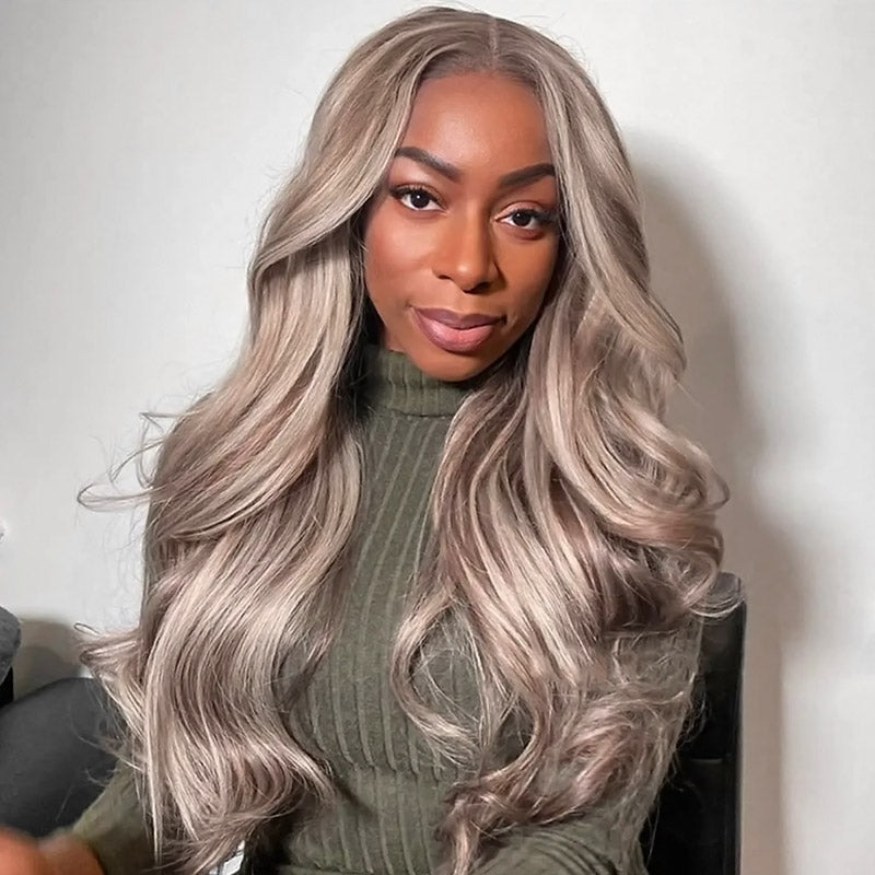 Side-by-side images of woman with long, wavy, blonde highlighted human hair wig from Ishow PPB™ collection, wearing a light blue jacket and necklace with 'J' pendant.