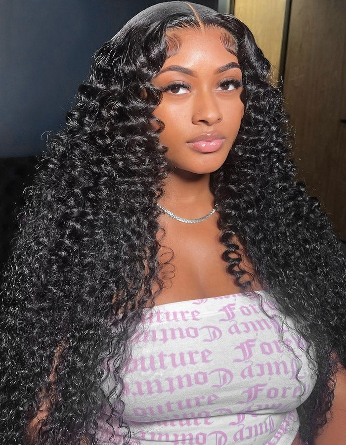 Model With Long Kinky Curly Hair Wearing a Graphic Top and a Necklace