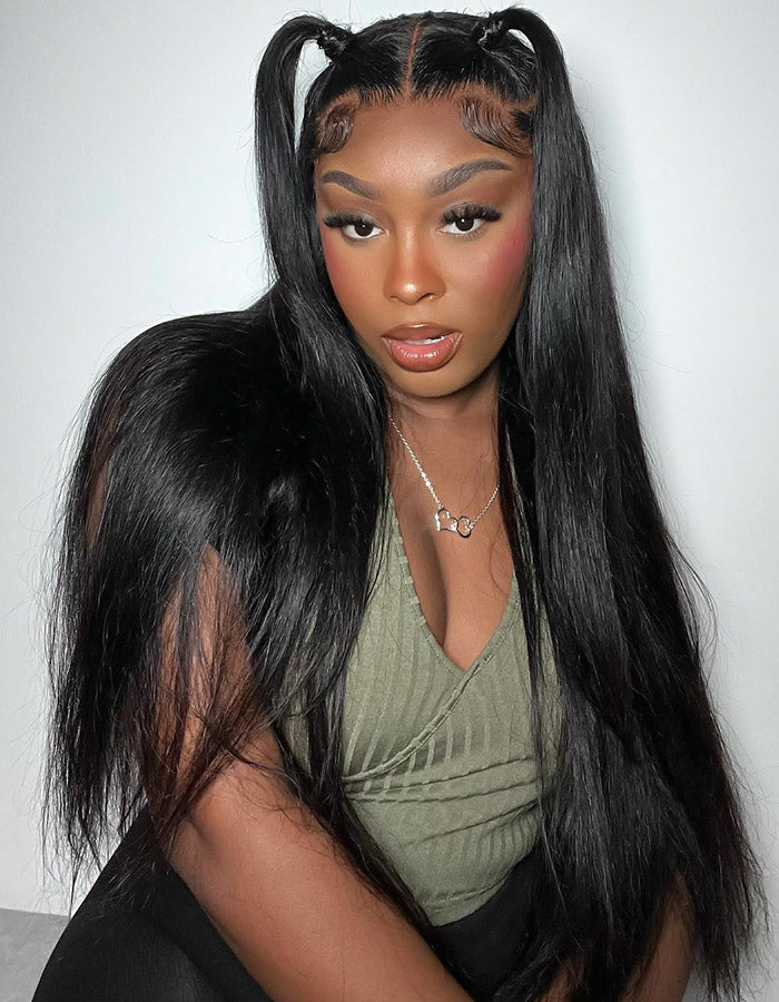 Model Showing Long Straight Black Hair With Two High Ponytails and a Green Top