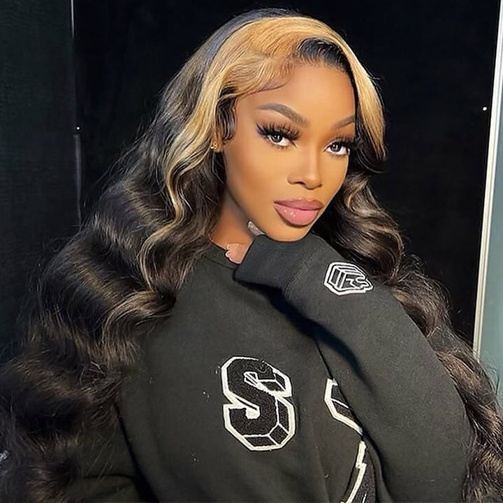 Model With Long Black and Blonde Highlighted Waves in a Black Sweatshirt