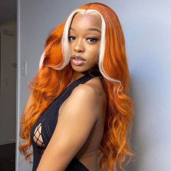 Woman Showcasing Ginger Blonde Body Wave Lace Front Wig With Long Curls