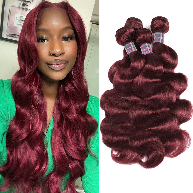 Woman with long, straight burgundy hair styled in a half-up bun sitting indoors next to four bundles of Ishow Brazilian human virgin hair in 99J Burgundy color with a straight texture.