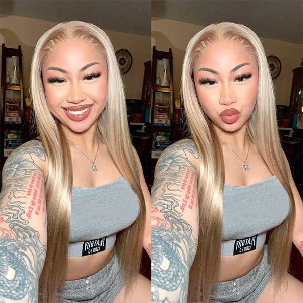 Smiling Woman With Long Blonde Hair and Tattoos in Grey Outfit