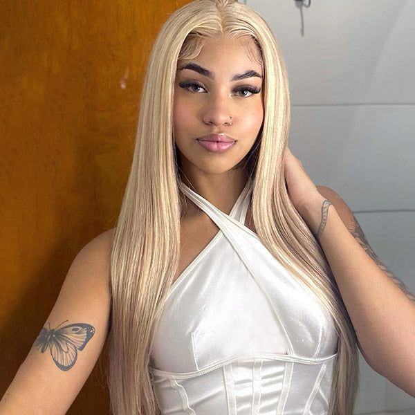 Woman With Long Straight Blonde Hair in a White Top, Posing Confidently
