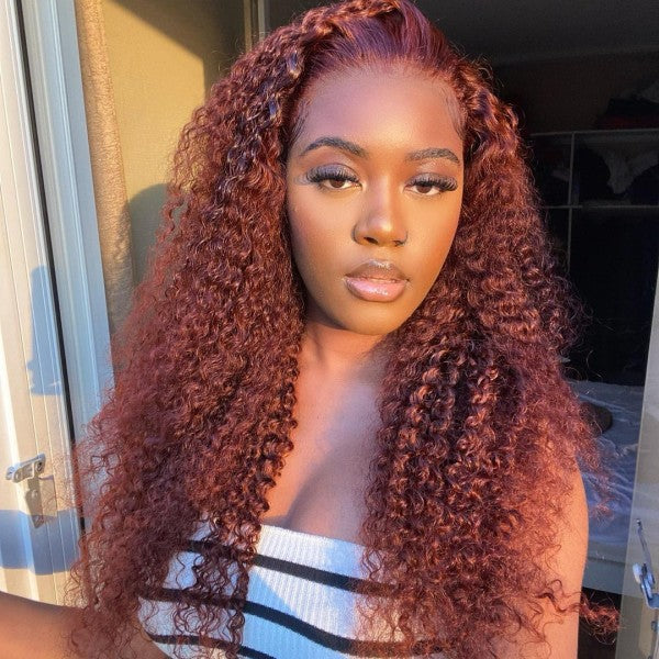 Woman With Shiny 30-Inch Auburn Deep Wave Wig Styled in Loose Curls