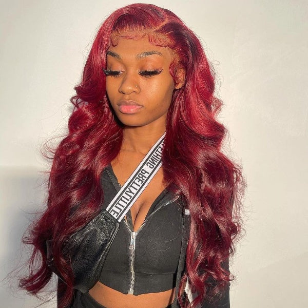 Model Showcasing Vibrant Red Body Wave Wig With Glossy Finish and Soft Waves