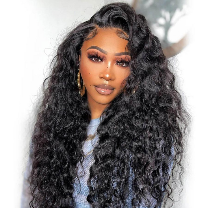 Woman wearing Ishow Hair 5x5 HD lace loose deep wave wig, glueless human hair wig in natural black, showcasing its voluminous and shiny wave texture.
