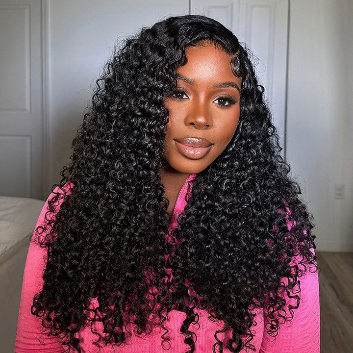 Model With Bouncy Kinky Curly Human Hair in Black, Wearing a Pink Top and Smiling