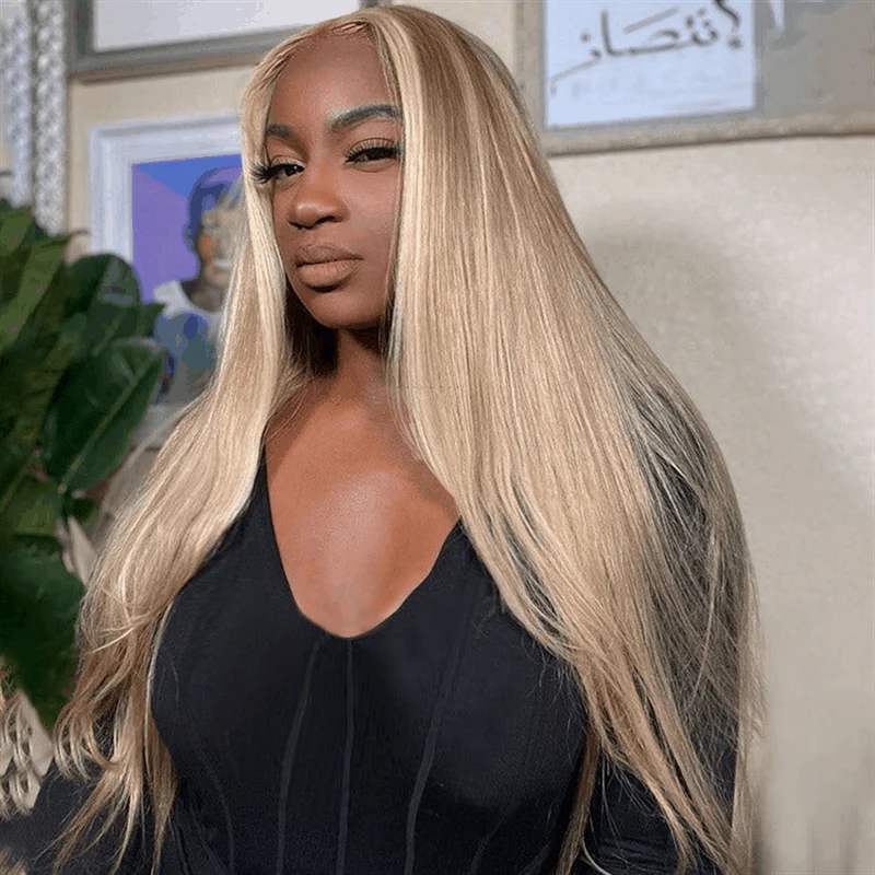 Long Straight Blonde Wig On a Woman in a Black Top With Stylish Indoor Decor
