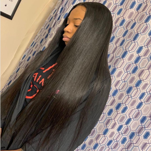 Model Showcasing 30 Inch Straight Black Lace Wig in Salon Setting