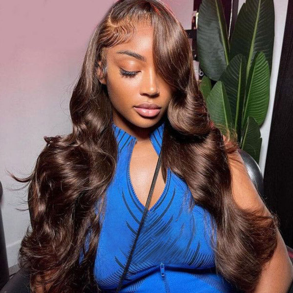Woman with long, wavy chocolate brown glueless body wave human hair wig, showcasing pre-plucked natural hairline and styled waves.