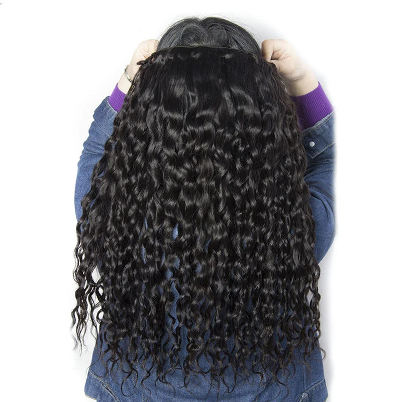 Displaying Natural Black Water Wave Hair Extensions Held By a Person