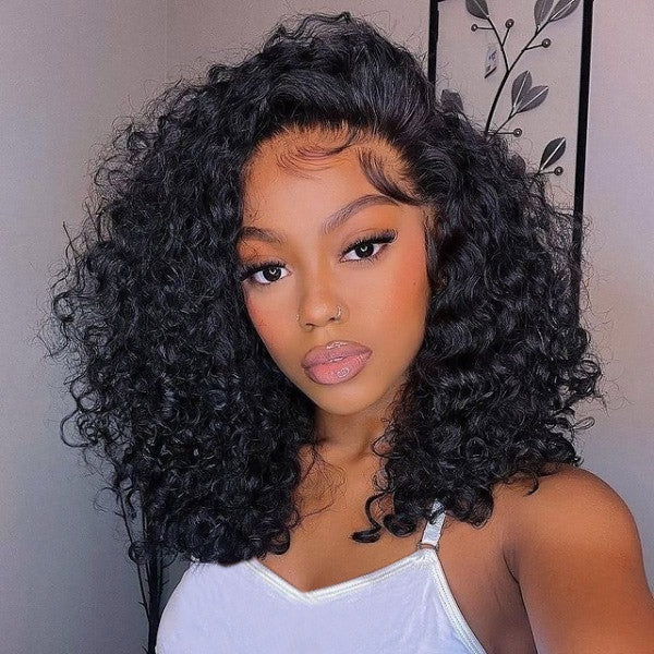 Woman in black top with necklace showcasing voluminous natural black water wave human hair bob wig with well-defined curls