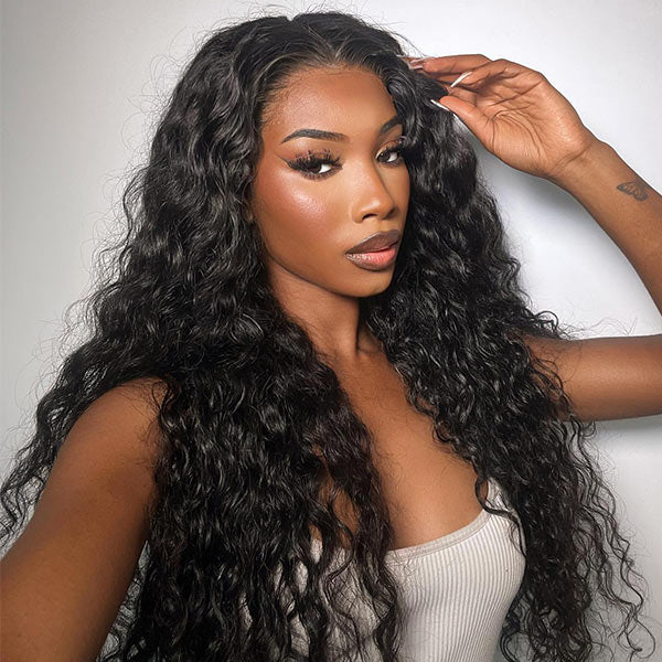 Woman modeling Ishow water wave 13x4 lace frontal wig with pre-plucked natural hairline in a brightly lit setting, showcasing 100% human hair wig.