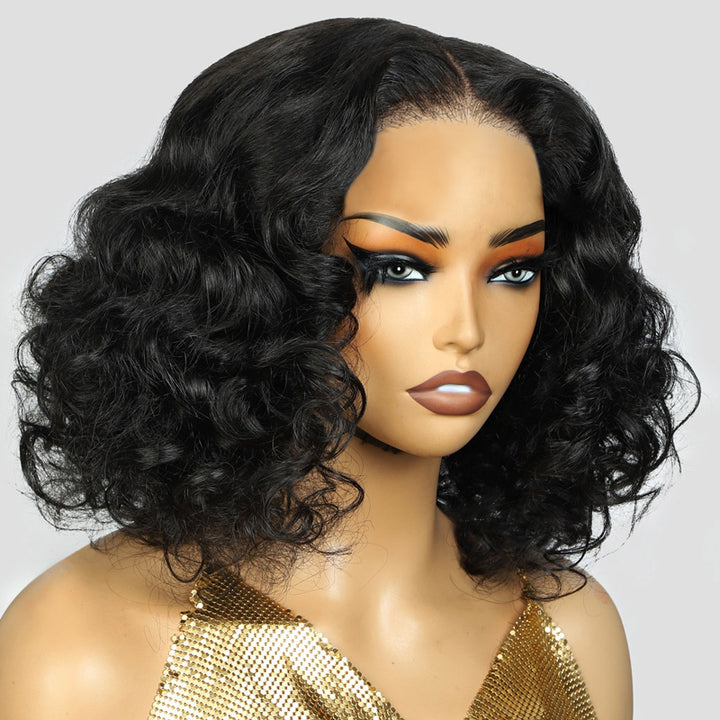 Mannequin head with a black funmi curly wig and gold top on a white background