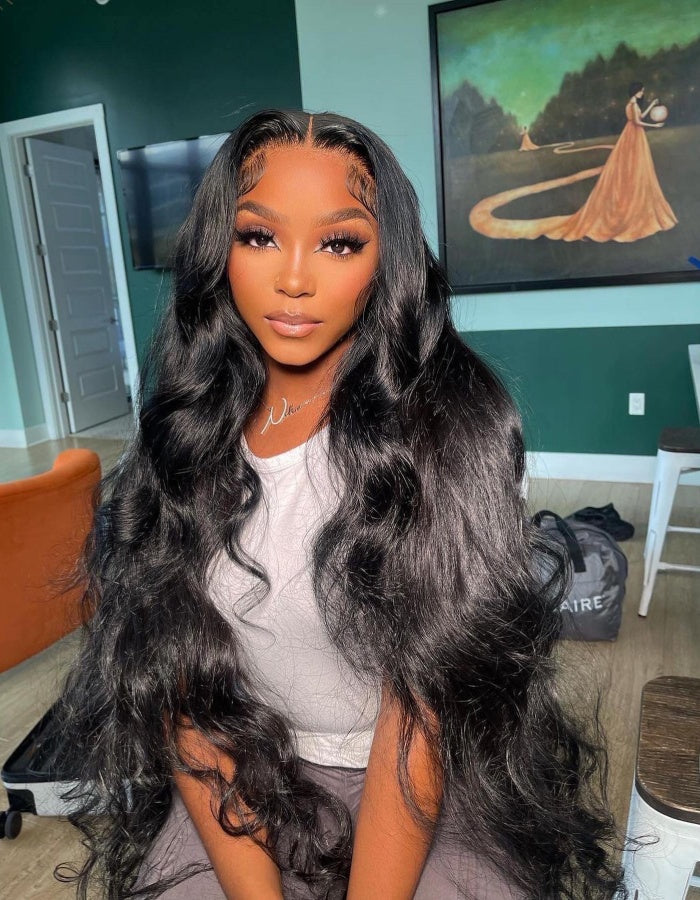 Model Showcasing Long Wavy Black Hairstyle With Luxurious Layers