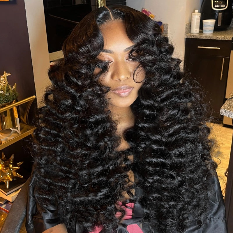 Model With Luxurious 22-Inch Loose Deep Wave Human Hair Wig in Natural Black