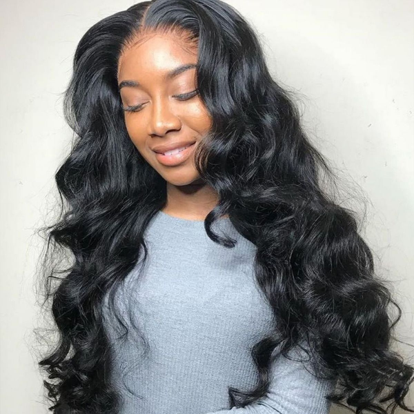 Model Showcasing Long, Voluminous Body Wave Hairstyle With Natural Black Color