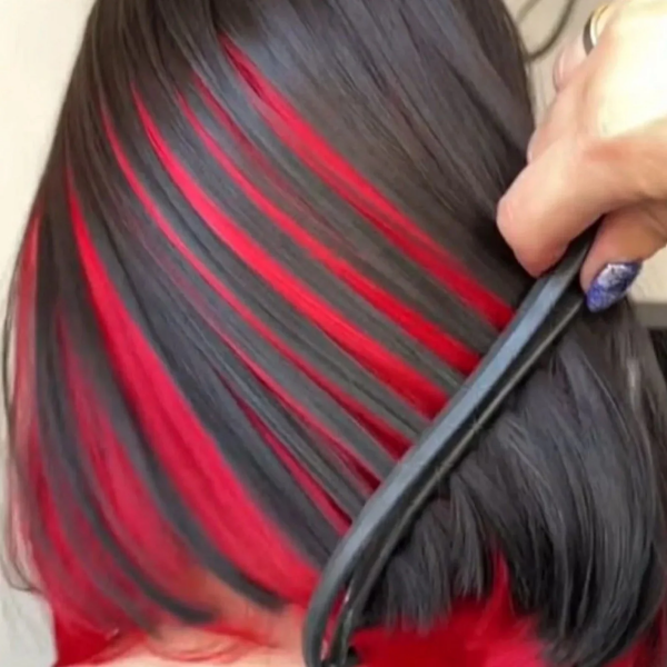 Short Bob Wig With Vibrant Red Highlights Styled With a Flat Iron