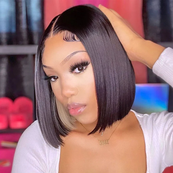 Model Highlighting a Straight Bob Wig With Blonde Highlights and Dark Base Color