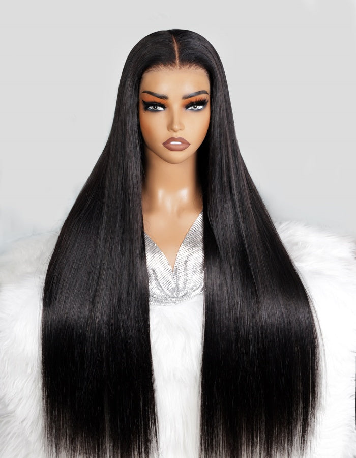 Sleek 30-Inch Straight Black Wig On a Model With a Sharp Center Part