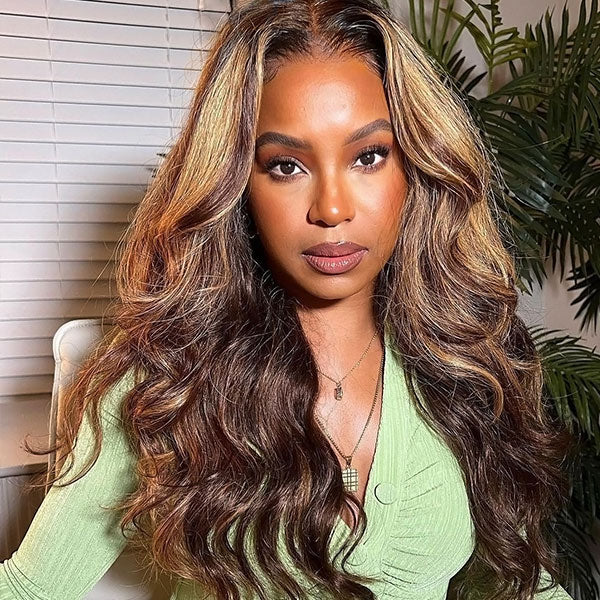 Woman With Highlighted Honey Blonde Body Wave Wig in Green Top