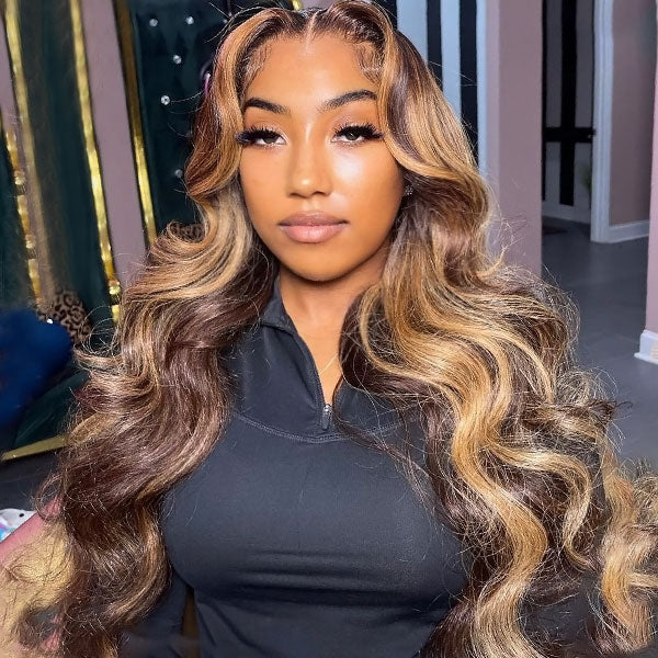Highlighted Honey Blonde Body Wave Wig On a Woman Wearing a Black Top
