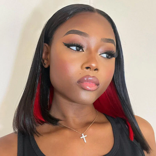 Model Showcasing Short Black Bob Wig With Peekaboo Red Highlights