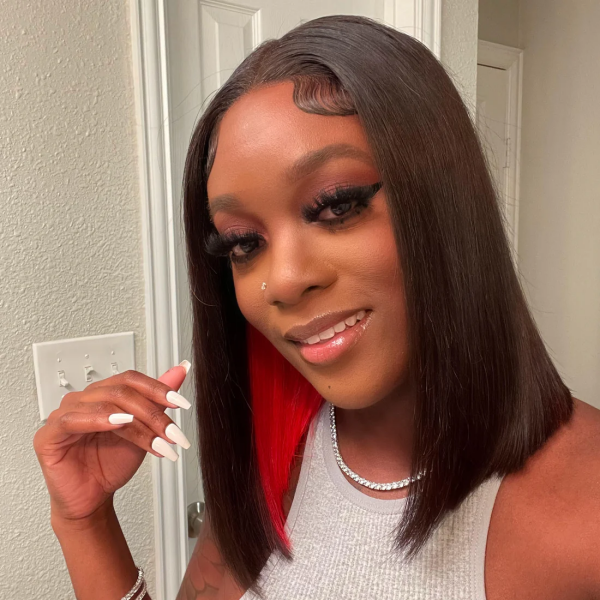 Woman With Straight Bob Wig Showcasing Red Peekaboo Highlights, Wearing a Gray Top