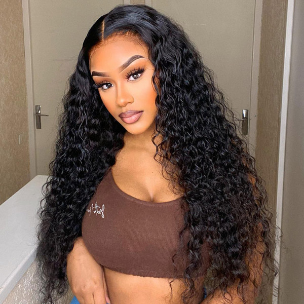 Woman Showcasing Long, Voluminous Deep Wave Hairstyle With Natural Curls