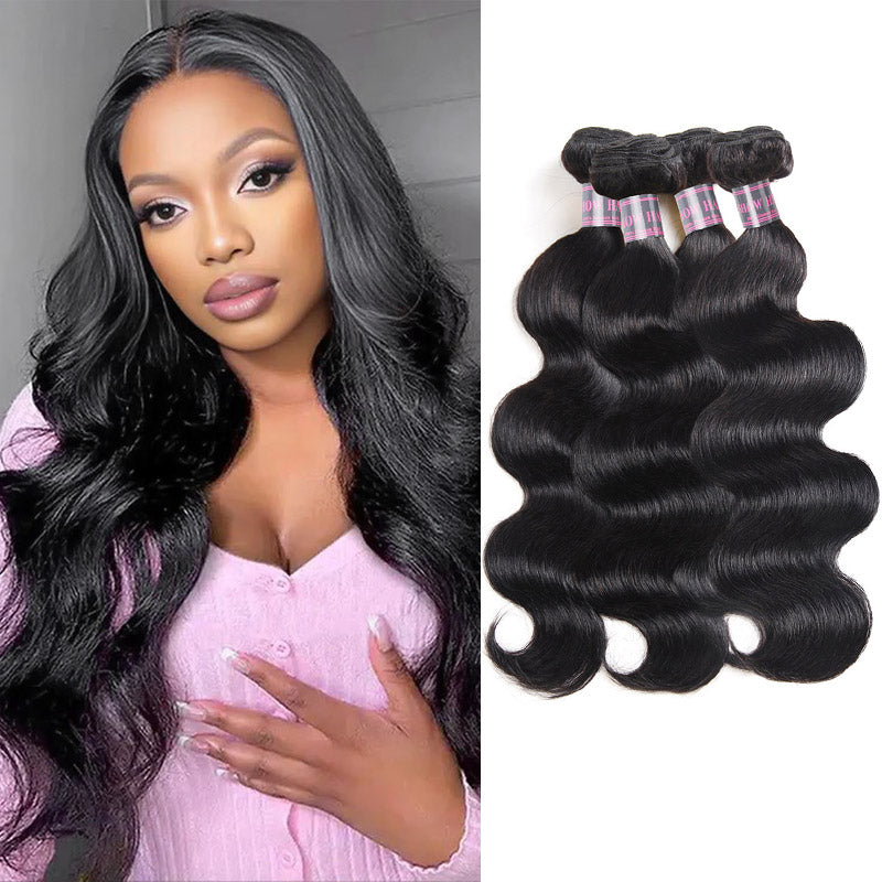 Woman with long, wavy jet black hair wearing a brown top next to four bundles of jet black wavy hair extensions held by a hand