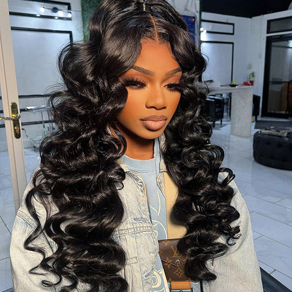 Model Sporting Natural Black Loose Deep Wave Wig in a Denim Jacket