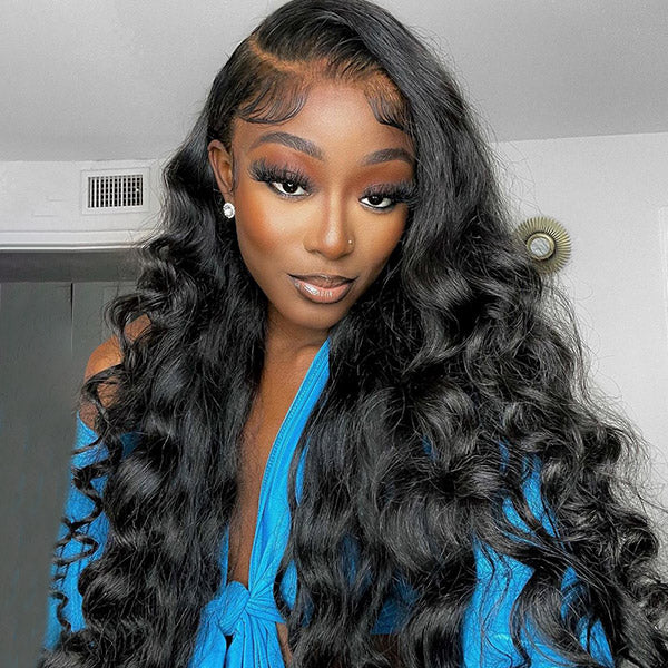 Model showcasing long Malaysian loose wave hair bundles with lace closure. Styled hair in natural black, wearing a sleeveless white top. Ishow human hair weave bundles.