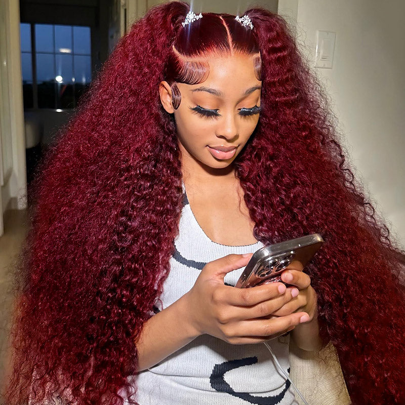 Woman With 99J Burgundy Curly Hair Using Smartphone, Styled in High Ponytails