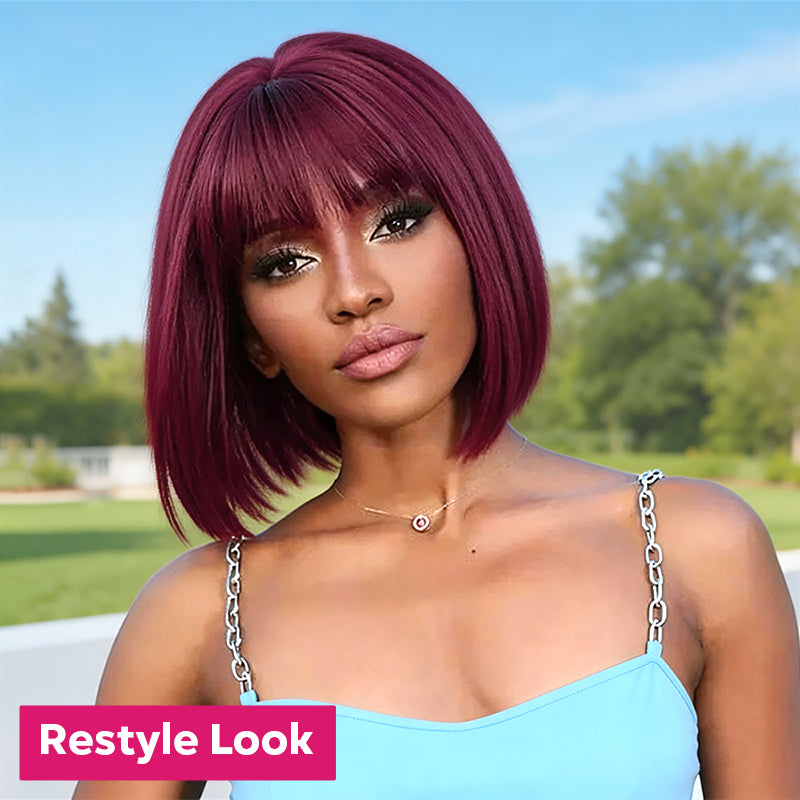 Woman with a bob wig with bangs outdoors, with 'Restyle Look' text overlay.
