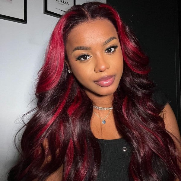 Woman With Long Black and Red Highlights Body Wave Wig, Showcasing Vibrant Hair Color