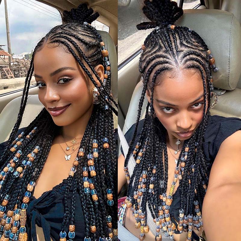 Woman Modeling Stylish Box Braids With Decorative Beads in Natural Black Hair