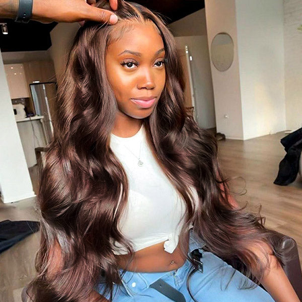 Woman Showcasing Long Chocolate Brown Body Wave Wig in a Salon