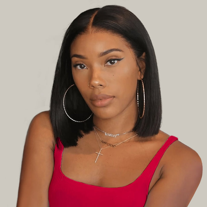 Woman With Straight Black Bob Hairstyle and Hoop Earrings